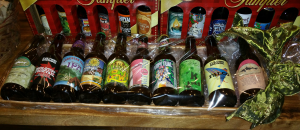 A variety of craft beers in a basket.